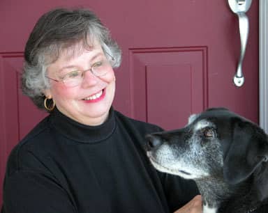 Photograph of betticlay, surface pattern designer, with dog.